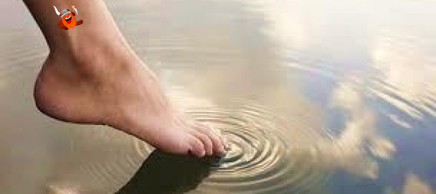 Image of a toe dipping in water